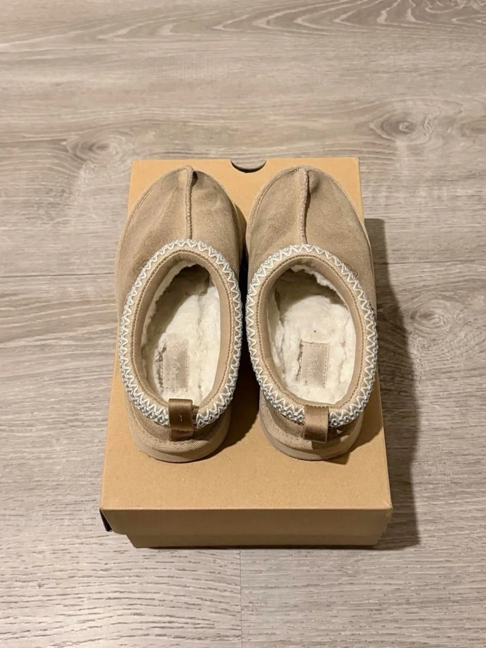 UGG Kids Slip-On Cozy Shearling Lined Slippers in Chestnut Tan